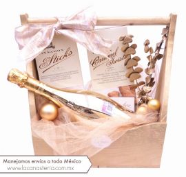 Hermosa y elegante canasta navideña con diseño boutique y exquisito vino espumoso de Bottega